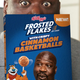 Shaq holds up a box of Frosted Flakes with Cinnamon Basketballs